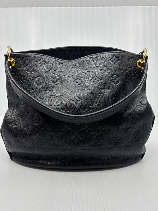 Posh Purse Co. black Louis Vuitton Monogram Empreinte Spontini handbag with embossed leather and gold hardware.