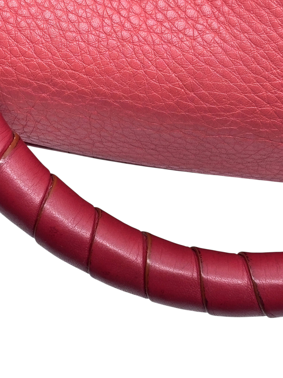 Close-up of Posh Purse Co. preowned Chloé Marcie satchel in coral leather showing textured grain and wrapped handle
