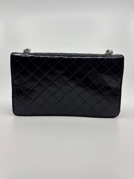 Posh Purse Co. Dolce & Gabbana black patent leather shoulder bag with silver hardware and quilted stitching.