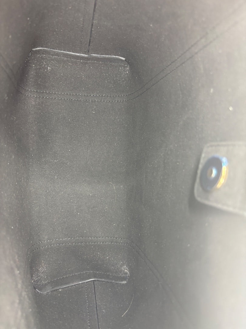 Posh Purse Co. black leather Dolce & Gabbana Dauphine Escape tote interior with protective hardware stickers.