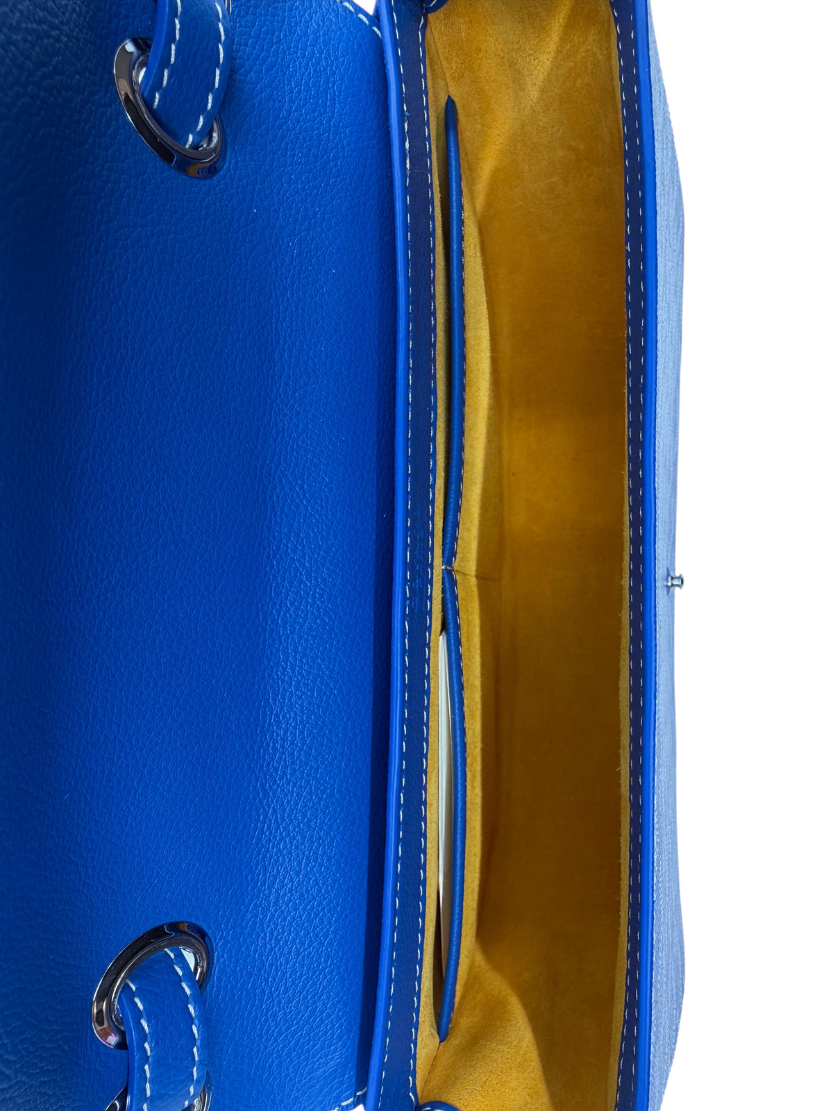 Interior of a blue Posh Purse Co. Goyard 233 handbag featuring yellow lining and leather trim details.