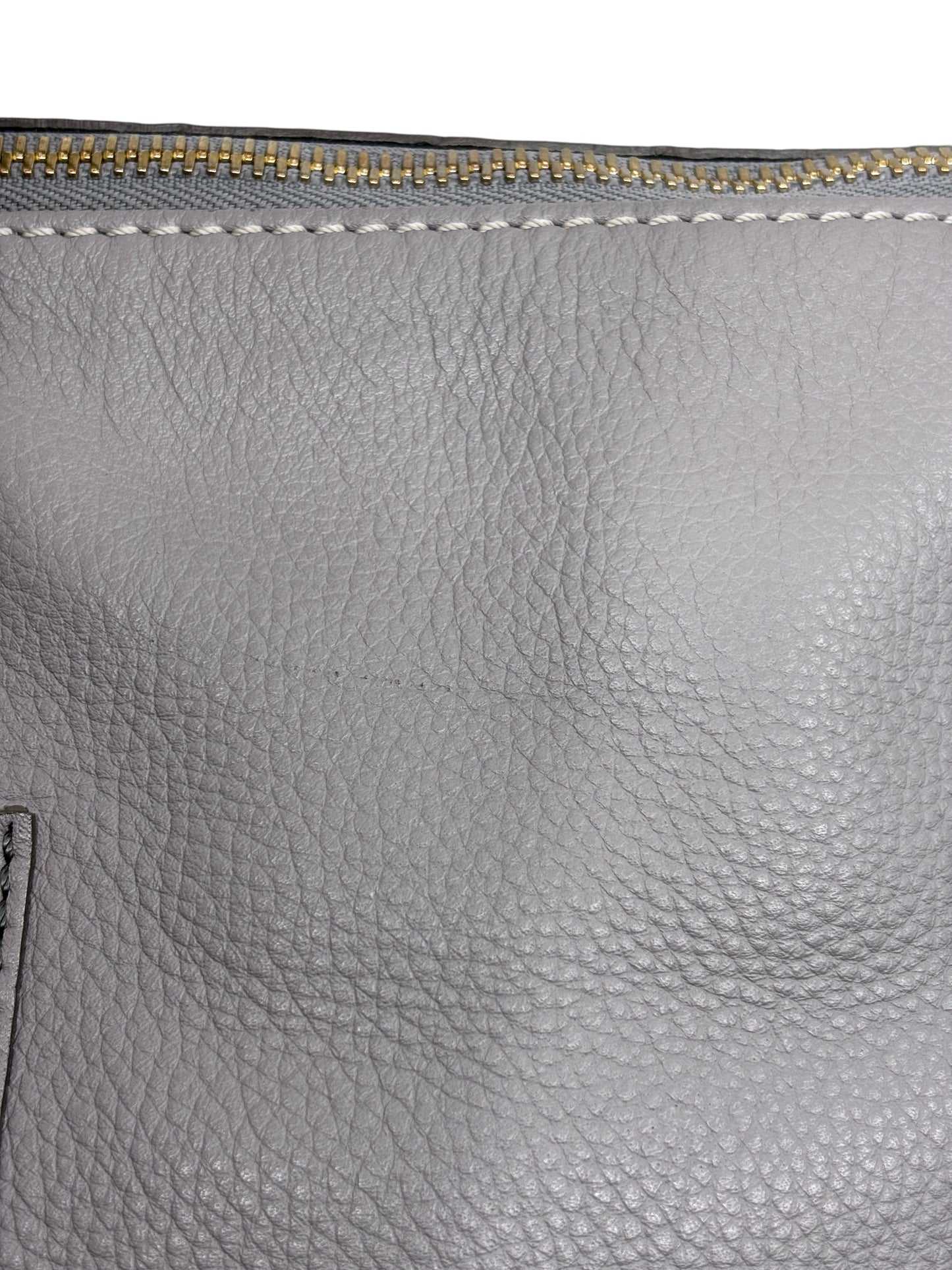 Close-up of gray pebbled leather on a Posh Purse Co Chloé Marcie satchel showing decorative stitching and gold zipper