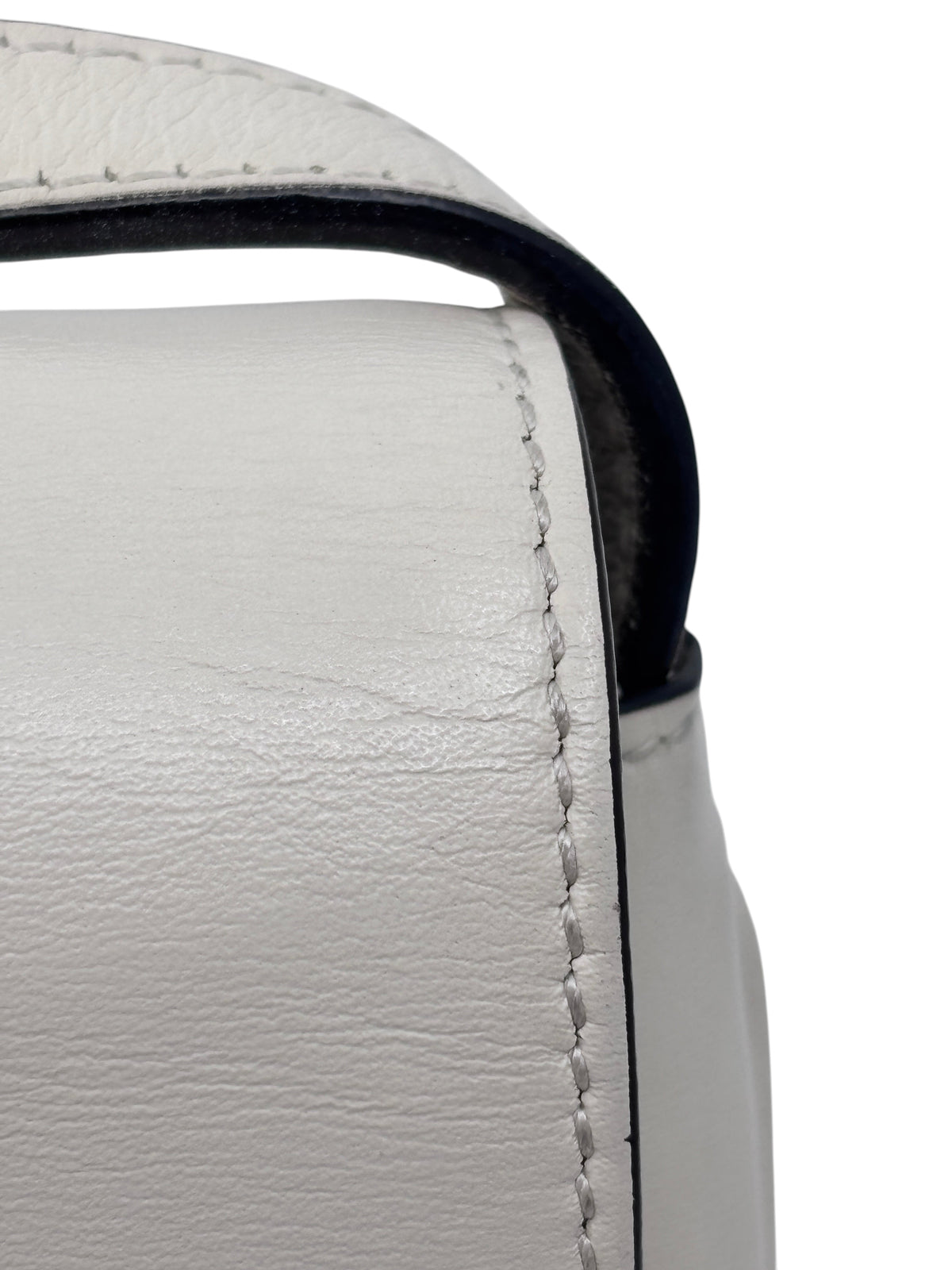 Close-up of the ivory leather stitching and edge detail on a Posh Purse Co. Gucci Arli handbag