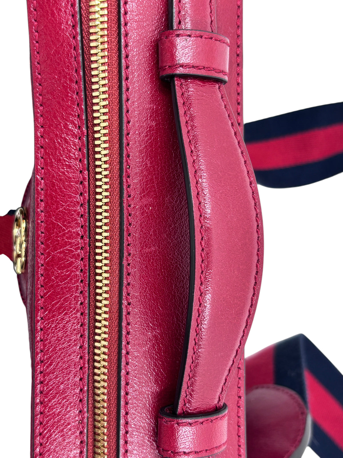 Posh Purse Co red leather and blue suede Gucci camera bag featuring gold hardware and a striped crossbody strap