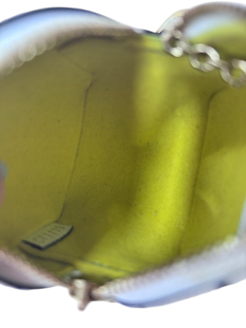 Interior view of Posh Purse Co Louis Vuitton 2019 Monogram Giant Cube Coin Purse with bright yellow lining