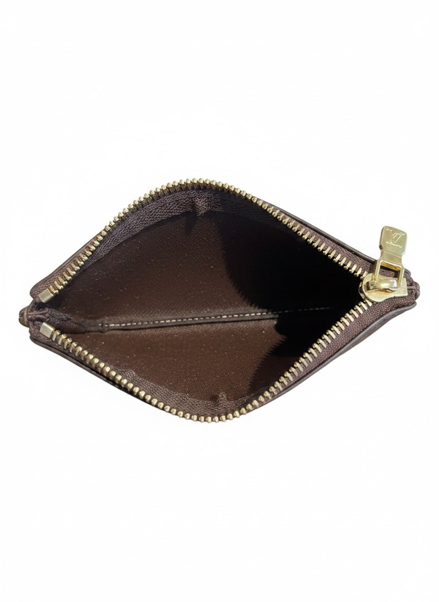 Posh Purse Co. Louis Vuitton Damier Ebene key pouch interior view with brown leather lining and gold zipper
