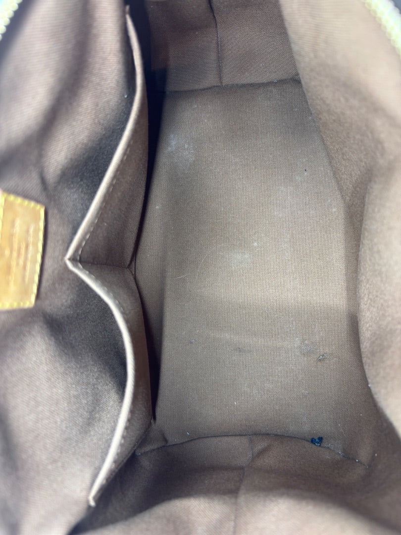 Posh Purse Co Louis Vuitton Monogram Tivoli handbag interior with brown canvas lining and pockets.