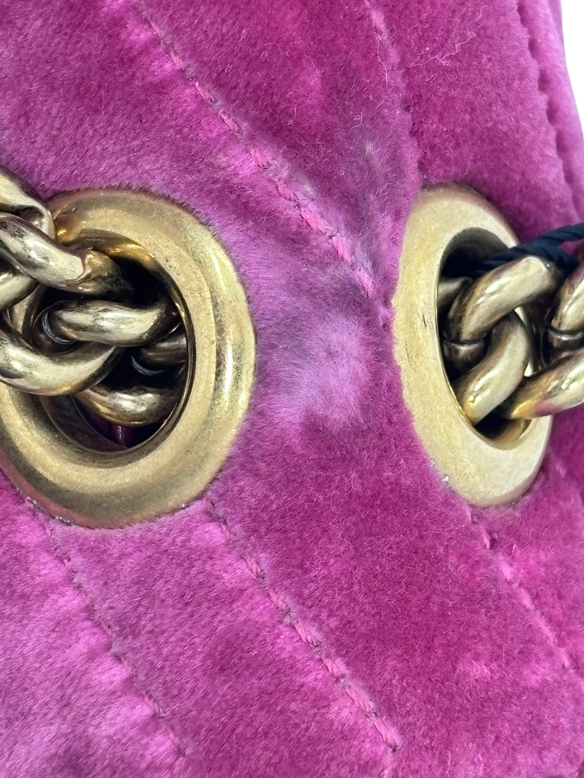 Posh Purse Co pink velvet Gucci Marmont shoulder bag showing gold chain hardware and quilted texture detail