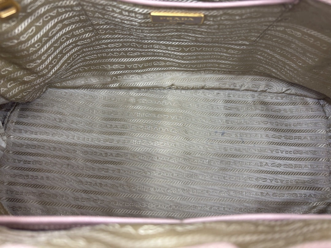 Posh Purse Co. large blush pink Prada tote interior with signature logo lining.