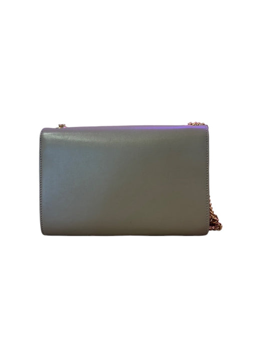 Posh Purse Co. Saint Laurent beige leather crossbody bag with gold chain strap and tassel detail.