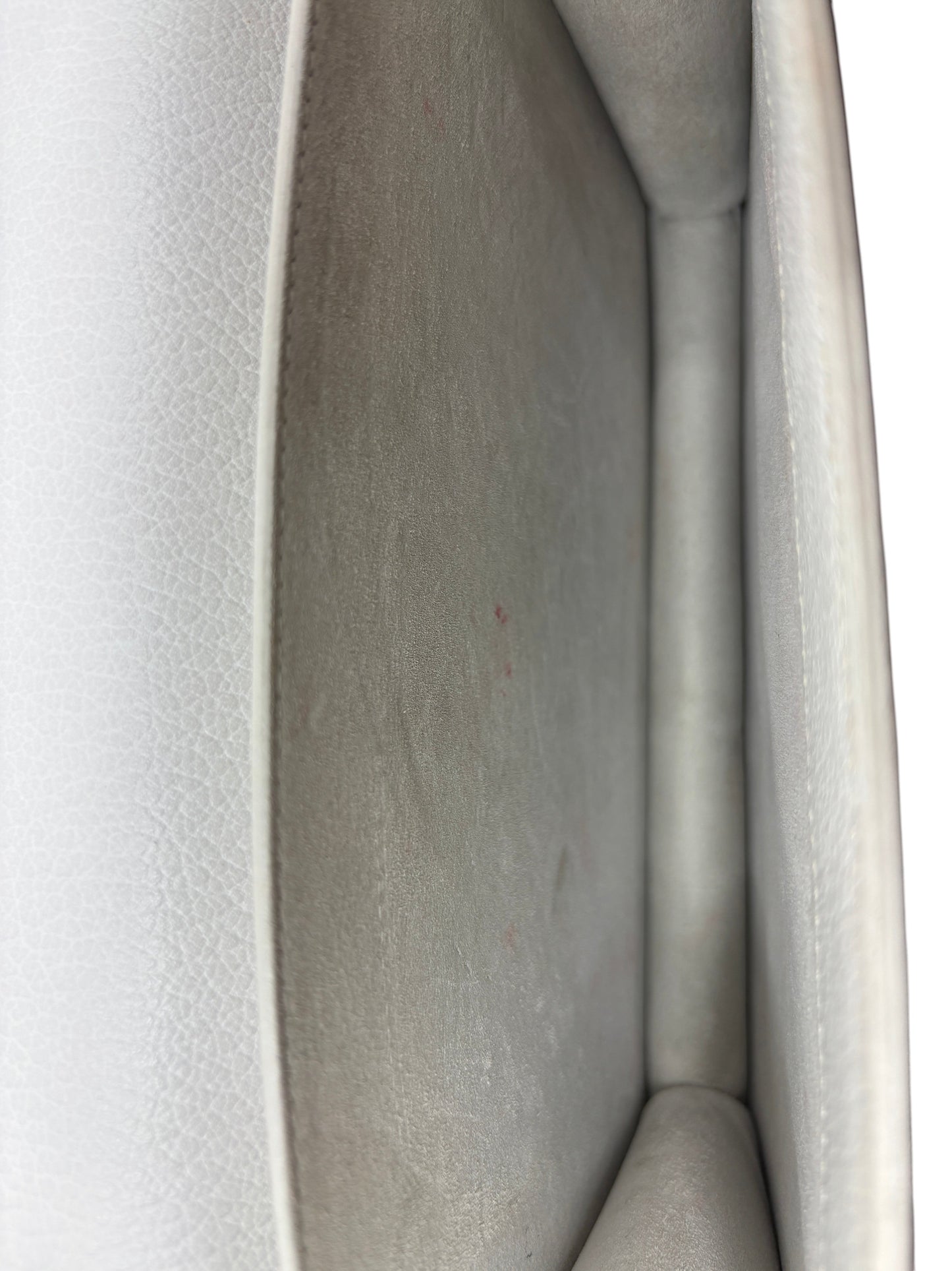 Interior view of a preloved white leather Saint Laurent Sunset bag showing light signs of wear from Posh Purse Co.