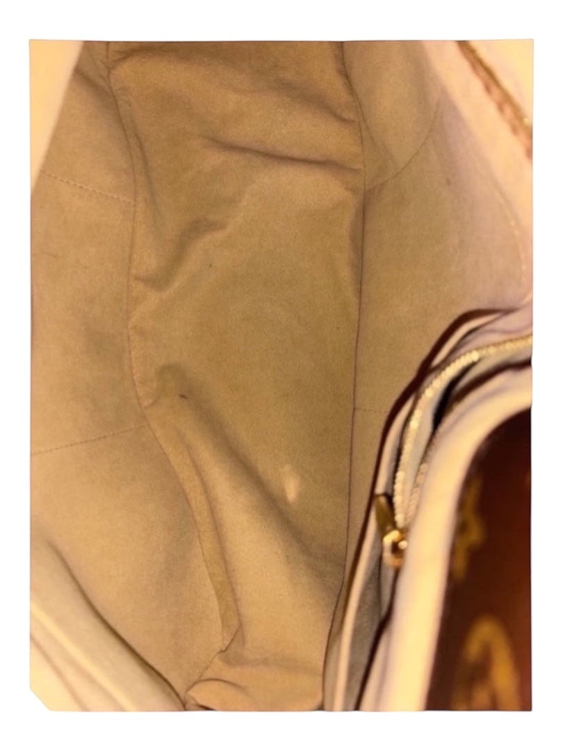Posh Purse Co Louis Vuitton Artsy MM monogram canvas hobo bag interior with beige lining and gold zipper detail.