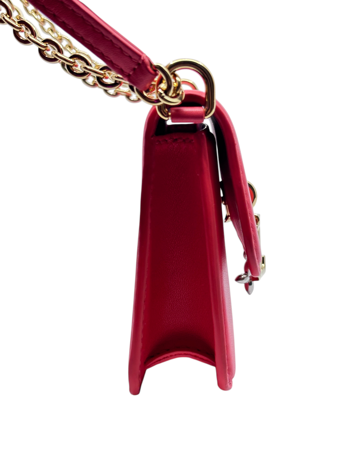 Side view of a pink Louis Vuitton Bloom Wallet on Chain with gold hardware from Posh Purse Co.