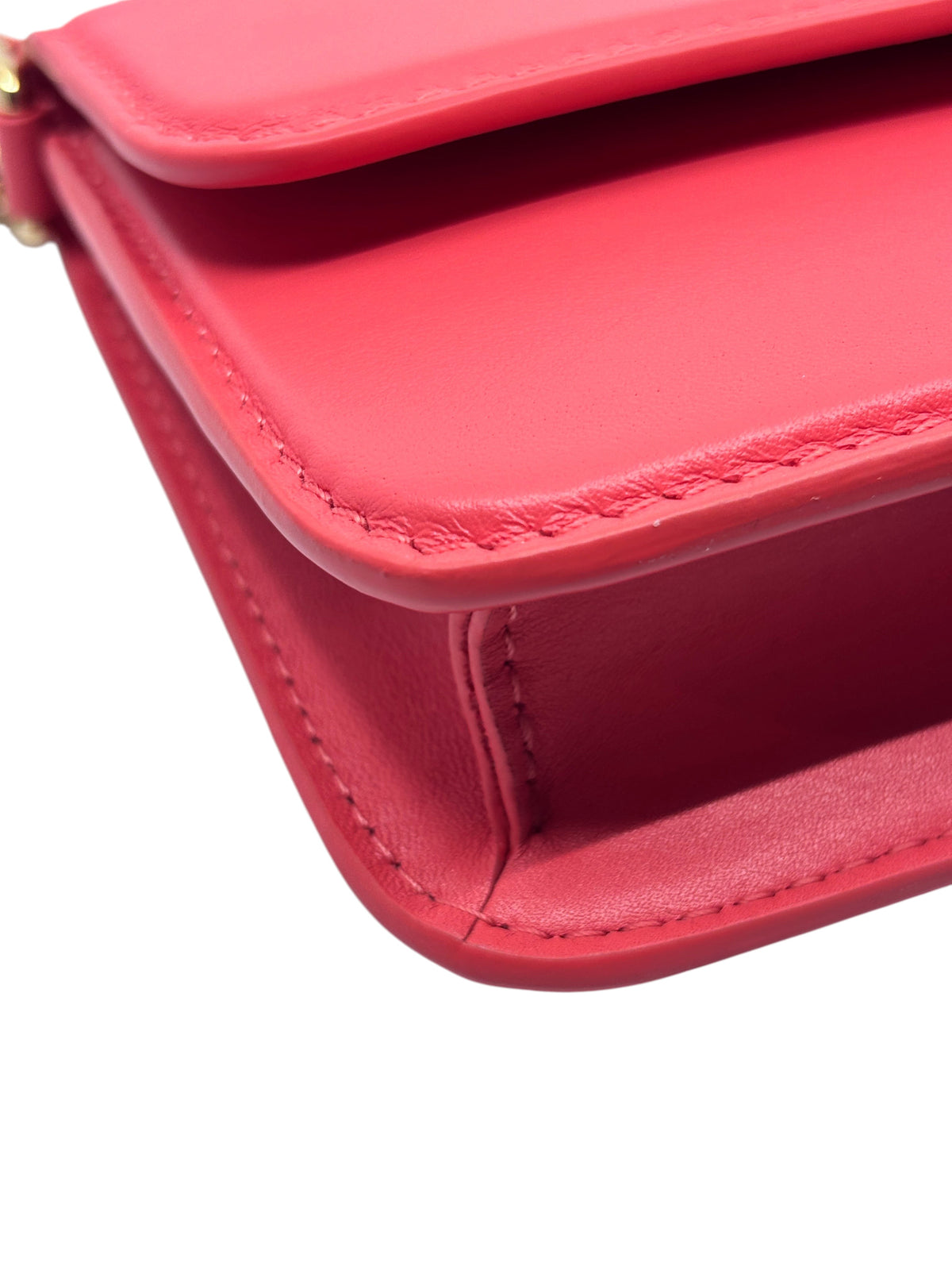 Close-up of the pink leather exterior and stitching on a Posh Purse Co. Louis Vuitton Bloom Wallet on Chain