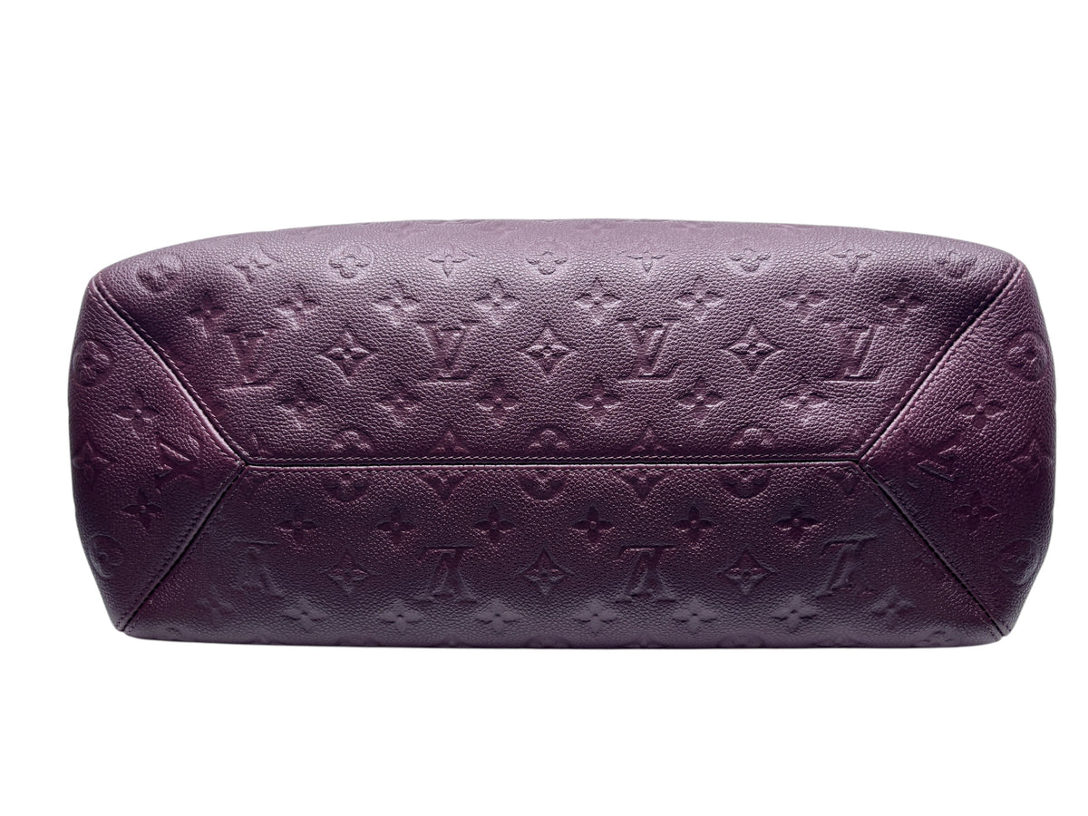Posh Purse Co. maroon Louis Vuitton Empreinte leather bag with embossed monogram pattern, bottom view.