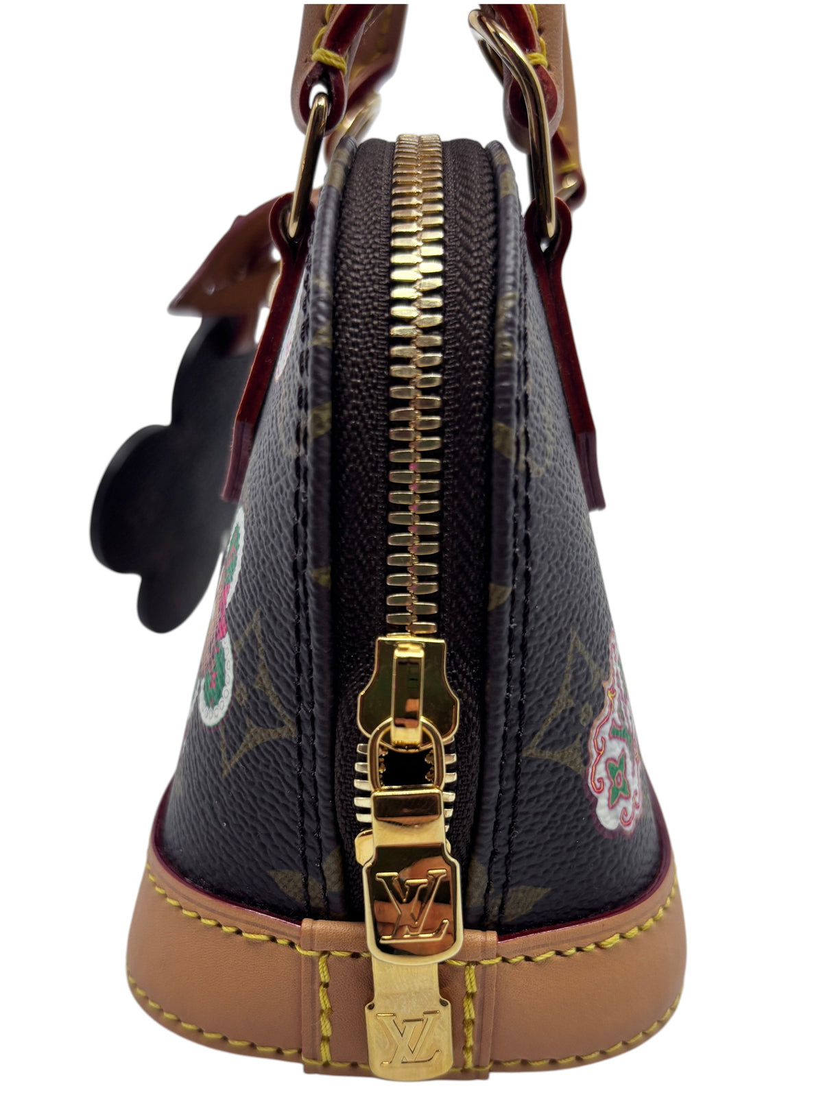 Posh Purse Co. Louis Vuitton Nano Alma 2024 Christmas Edition handbag side view with gold hardware and monogram canvas