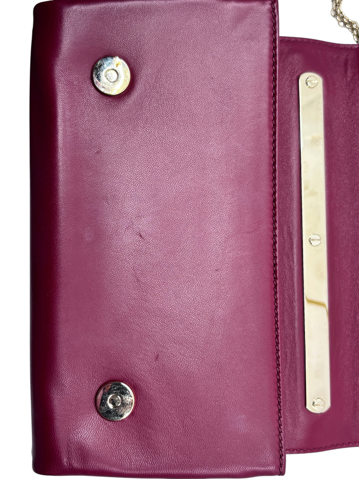 Posh Purse Co. preloved red Valentino leather crossbody bag interior flap with gold-tone hardware and snap closures.