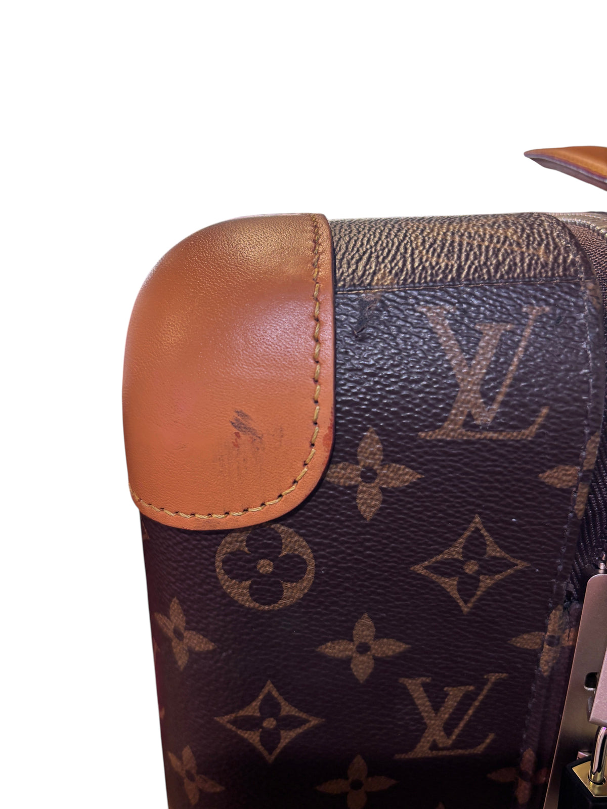 Posh Purse Co. Louis Vuitton Horizon 55 suitcase corner detail featuring brown monogram canvas and tan leather trim.