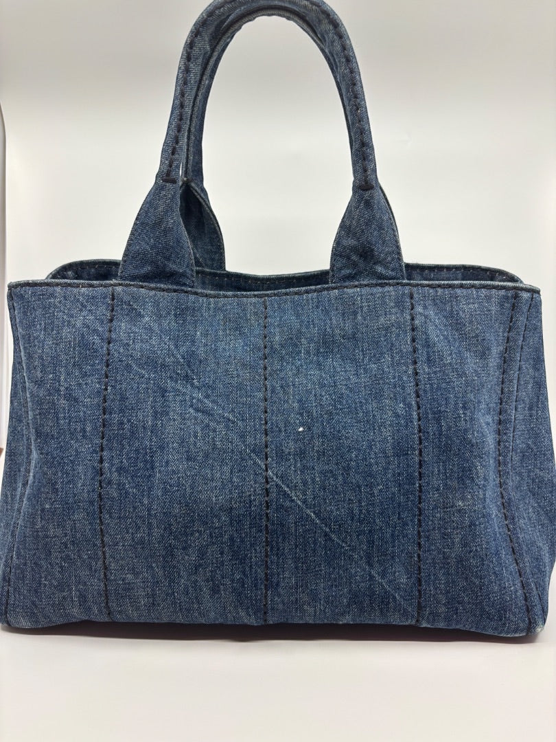 Posh Purse Co Avio blue denim tote bag with top handles and dark stitching detail.