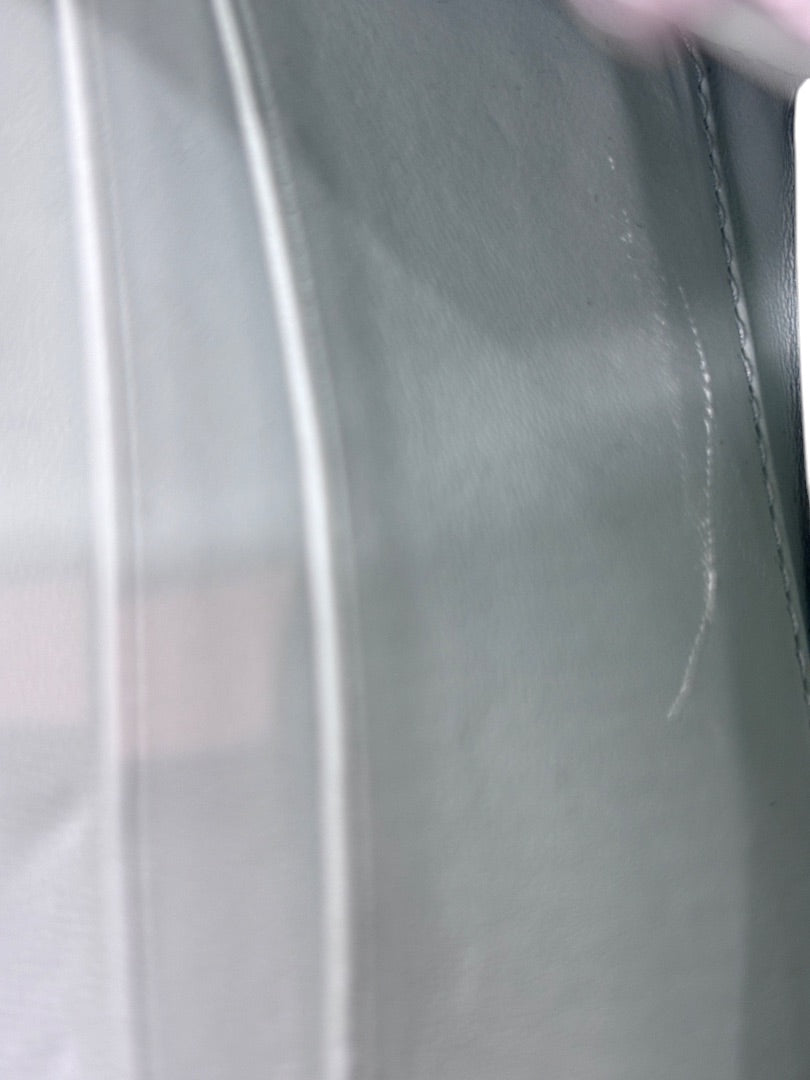 Interior view of Posh Purse Co preloved Balenciaga Hourglass bag showing surface wear and scratches on leather lining