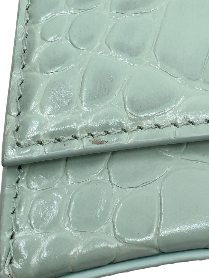 Close-up of Posh Purse Co Balenciaga Hourglass bag in light green croc-embossed leather showing surface wear