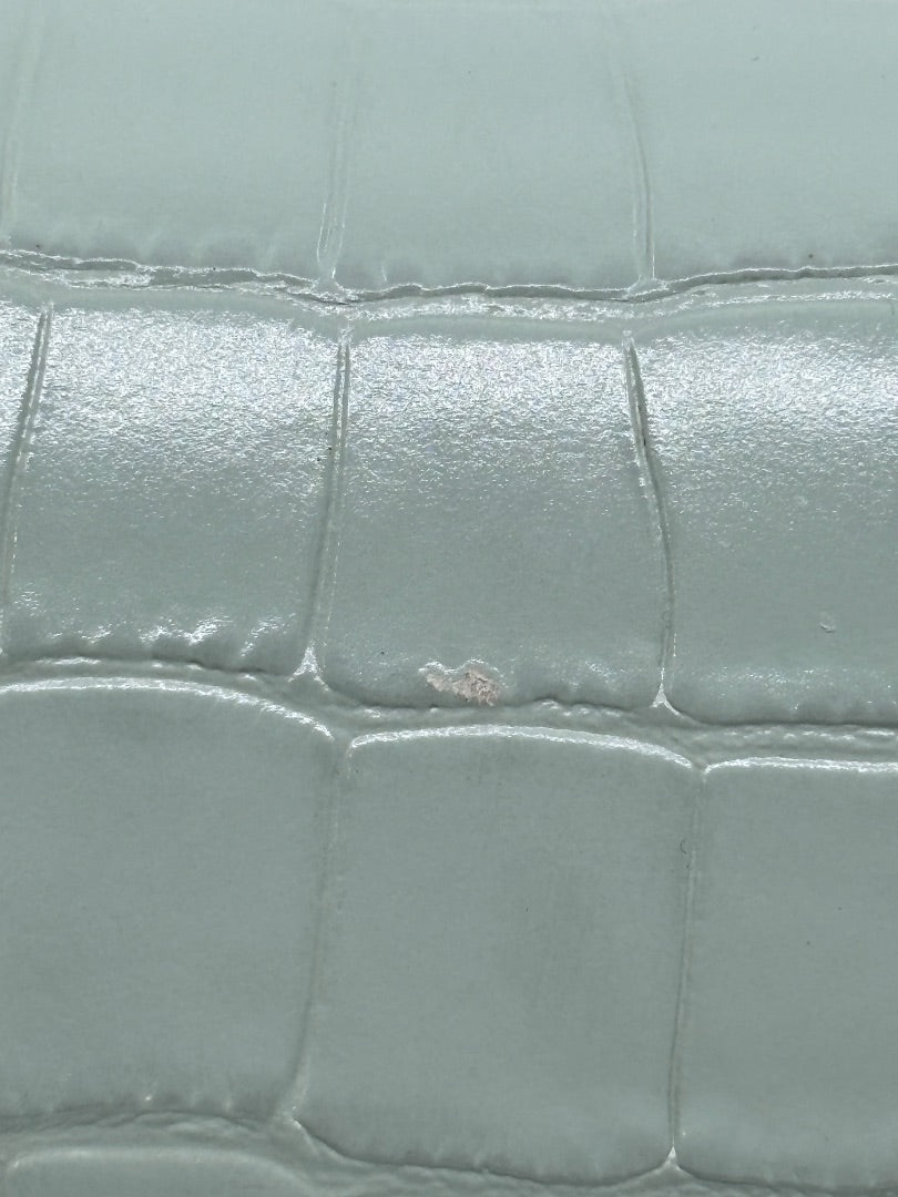 Close-up of light blue croc-embossed leather on a Posh Purse Co Balenciaga Hourglass bag showing surface wear.