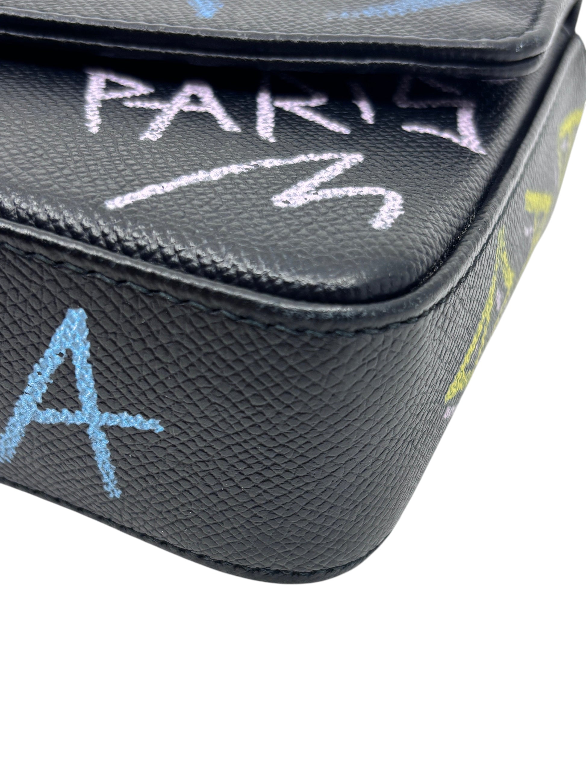 Posh Purse Co black Balenciaga wallet on chain featuring textured leather and artistic graffiti print detail