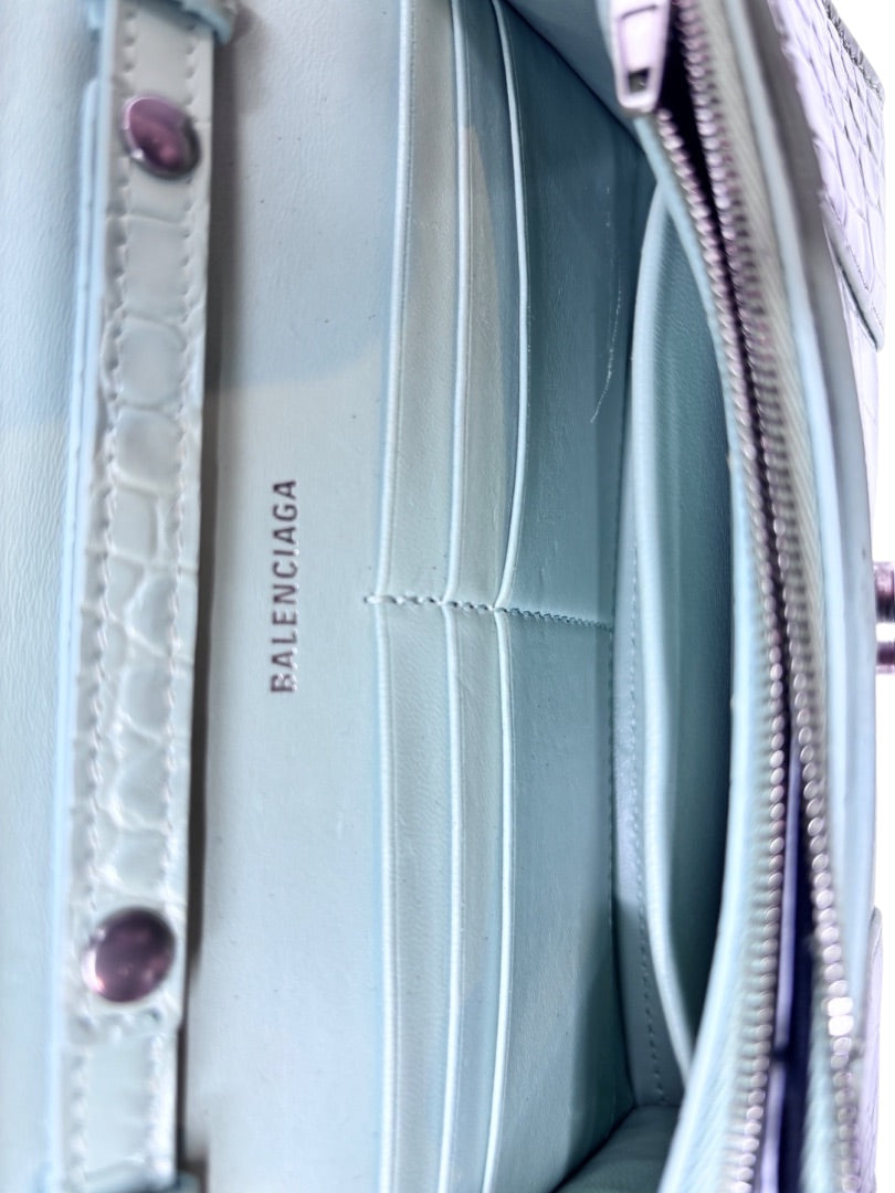 Interior of a light blue Posh Purse Co Balenciaga Hourglass bag showing card slots and embossed logo