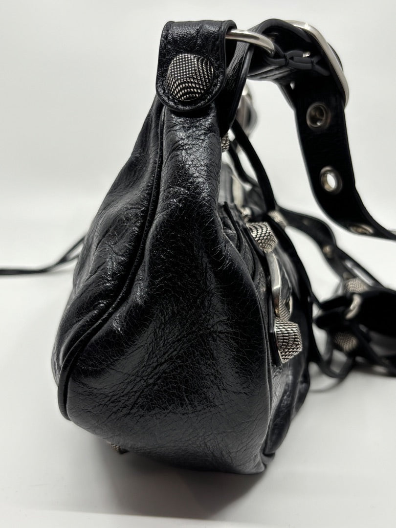 Posh Purse Co. black leather Balenciaga La Cagole shoulder bag with studded details and aged hardware.