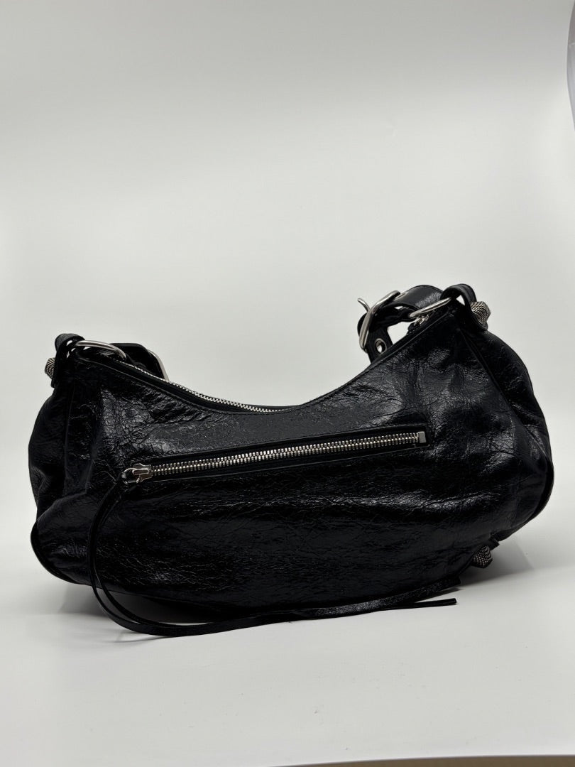 Posh Purse Co. Balenciaga La Cagole black leather shoulder bag with silver hardware and zip closure.