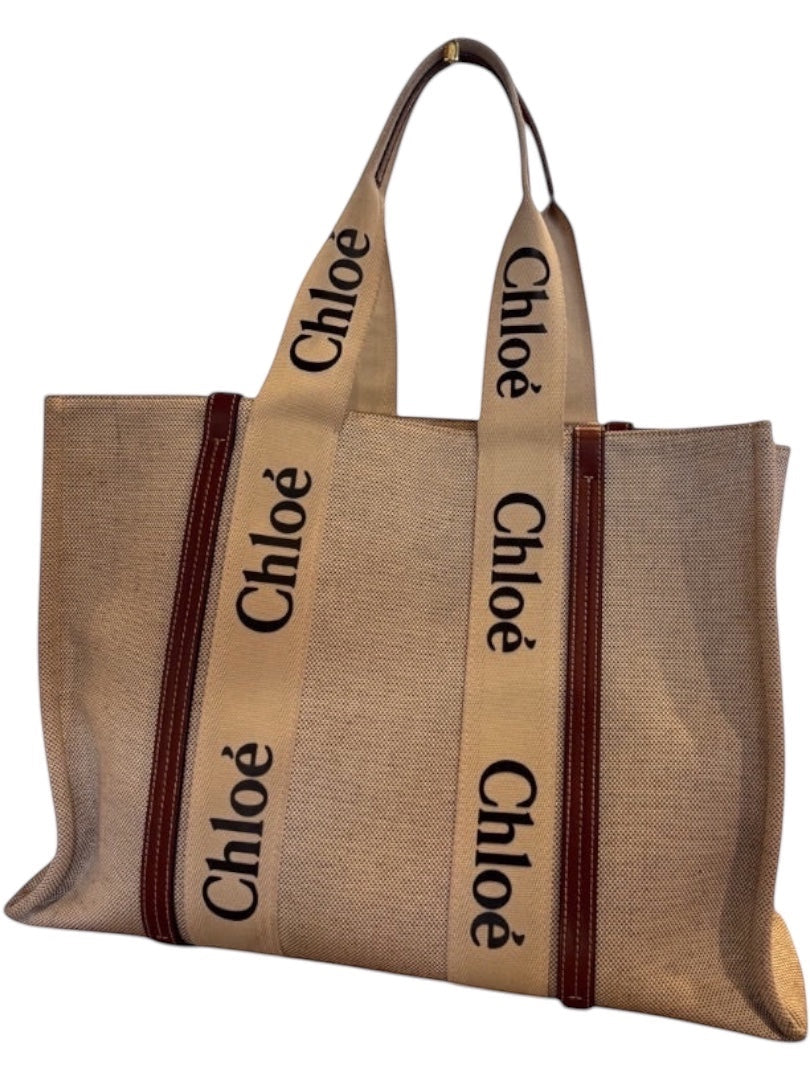 Posh Purse Co beige canvas large Chloe Woody tote bag with brown leather trim and Chloe logo straps.
