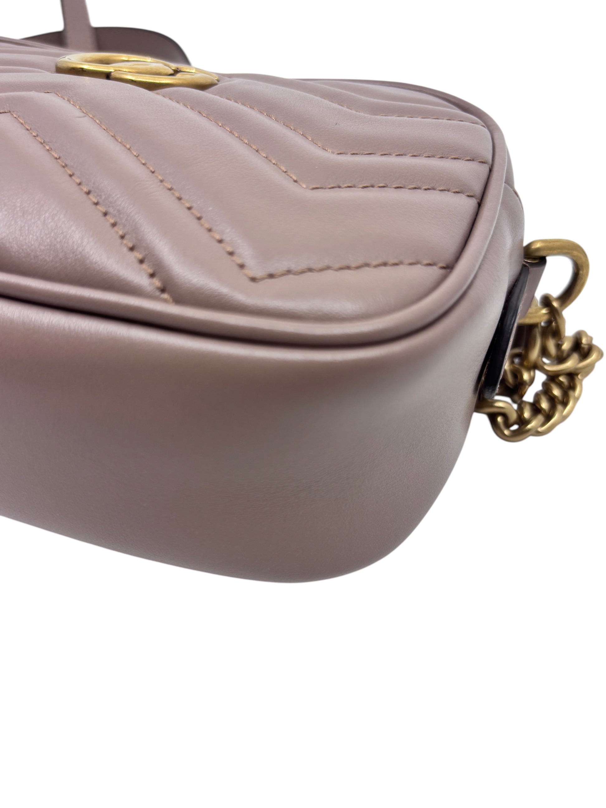 Posh Purse Co. beige Gucci camera bag featuring chevron quilted leather and antique gold-tone chain strap detail.