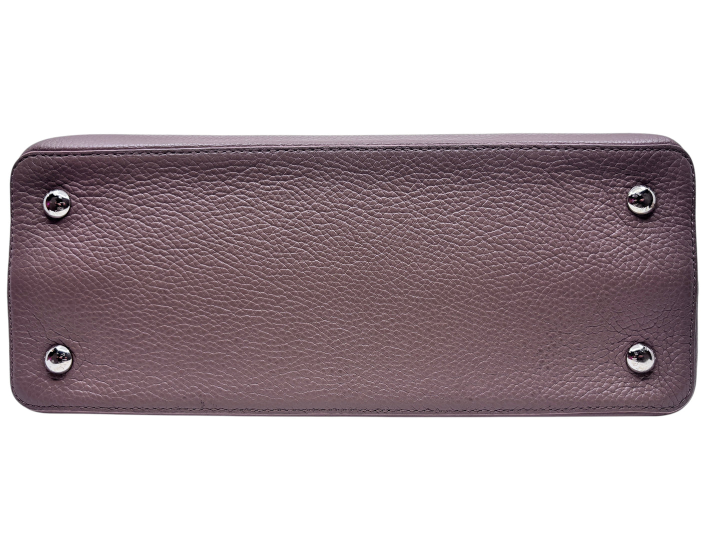 Base of a beige Louis Vuitton Capucines MM handbag from Posh Purse Co featuring protective silver metal feet