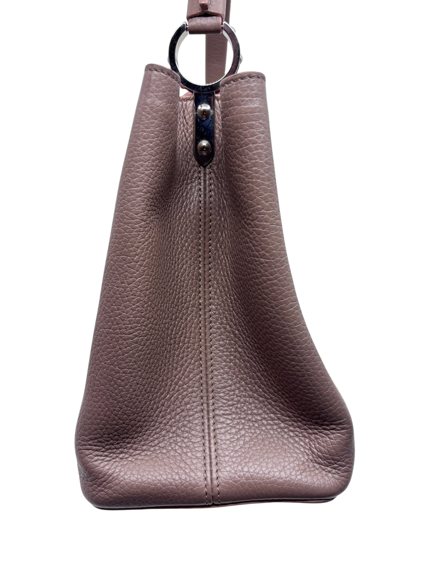 Side view of a beige Posh Purse Co preloved Louis Vuitton Capucines MM handbag in textured leather with silver hardware.