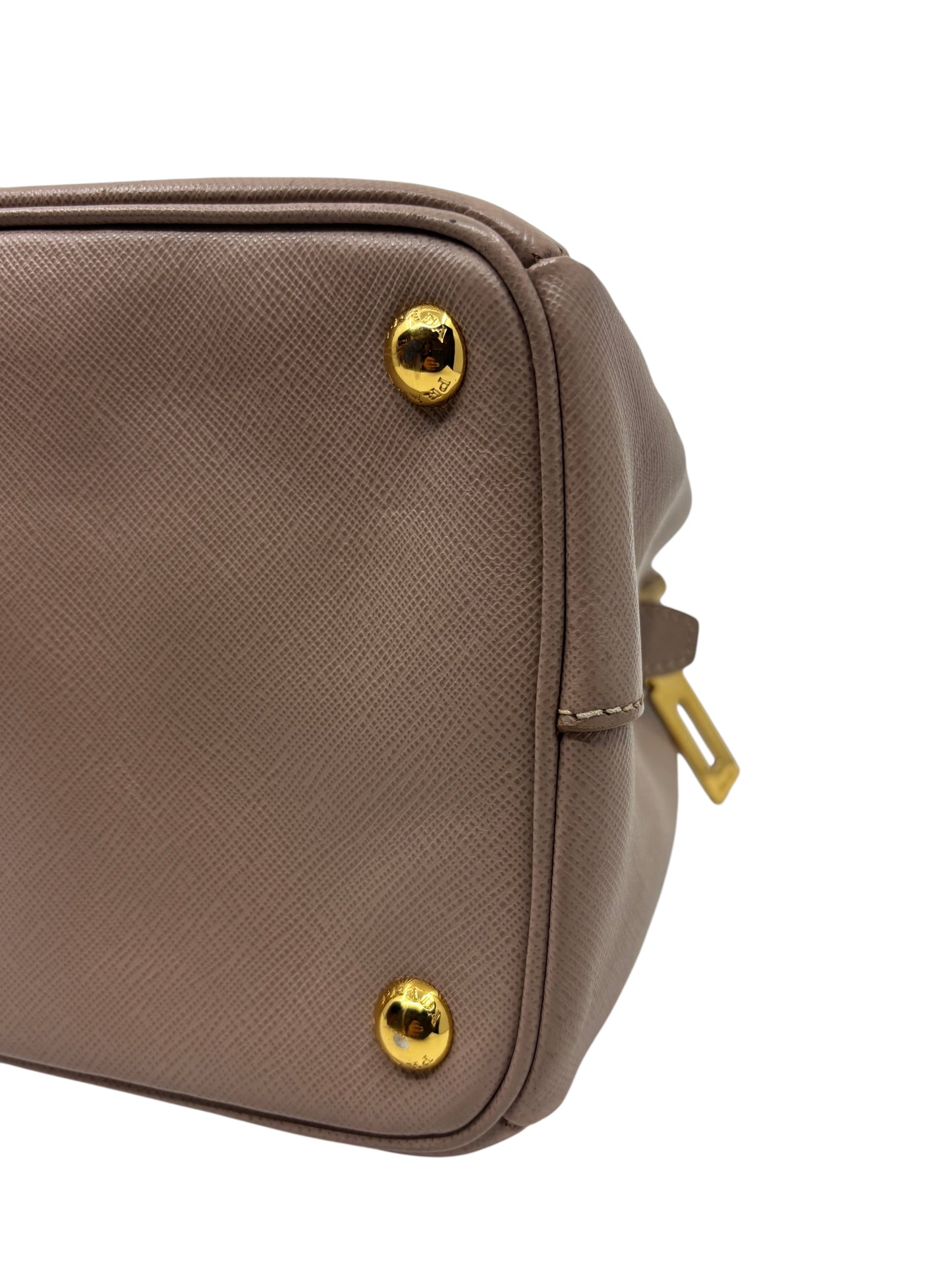 Posh Purse Co. beige Saffiano leather Prada tote bag base detail with gold protective feet