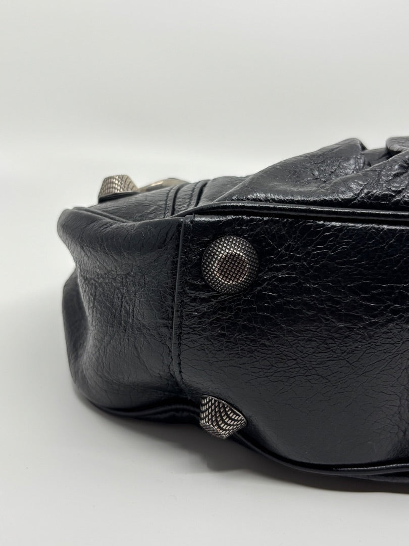 Posh Purse Co. black leather Balenciaga La Cagole bag with studded hardware details.