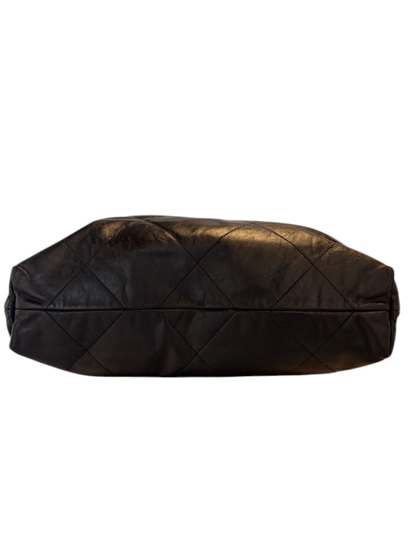 Posh Purse Co. Large Black Chanel 22 bag in shiny calfskin leather with gold hardware and diamond quilting.