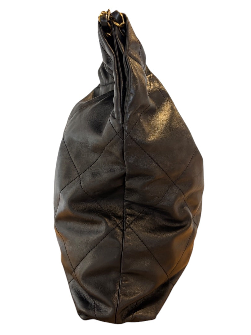 Posh Purse Co. Large Black Chanel 22 bag in shiny calfskin leather with gold hardware and diamond quilting.