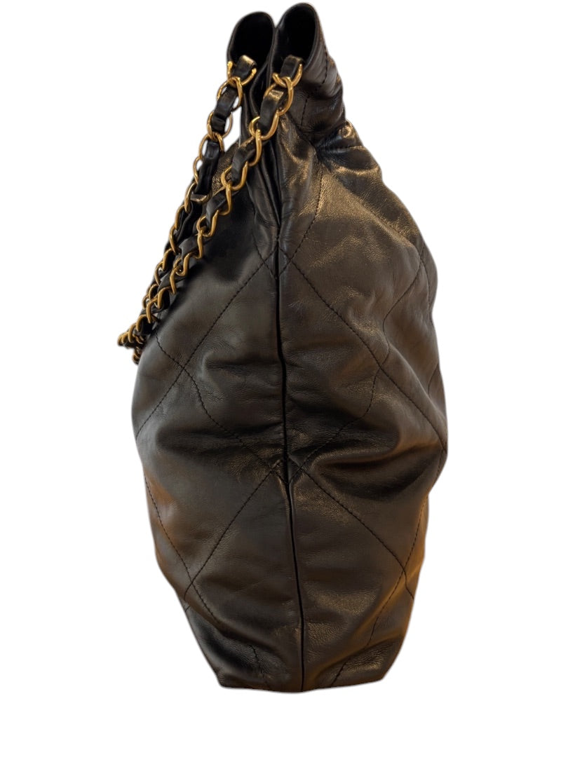 Posh Purse Co. Large Black Chanel 22 bag in shiny calfskin leather with gold hardware and diamond quilting.