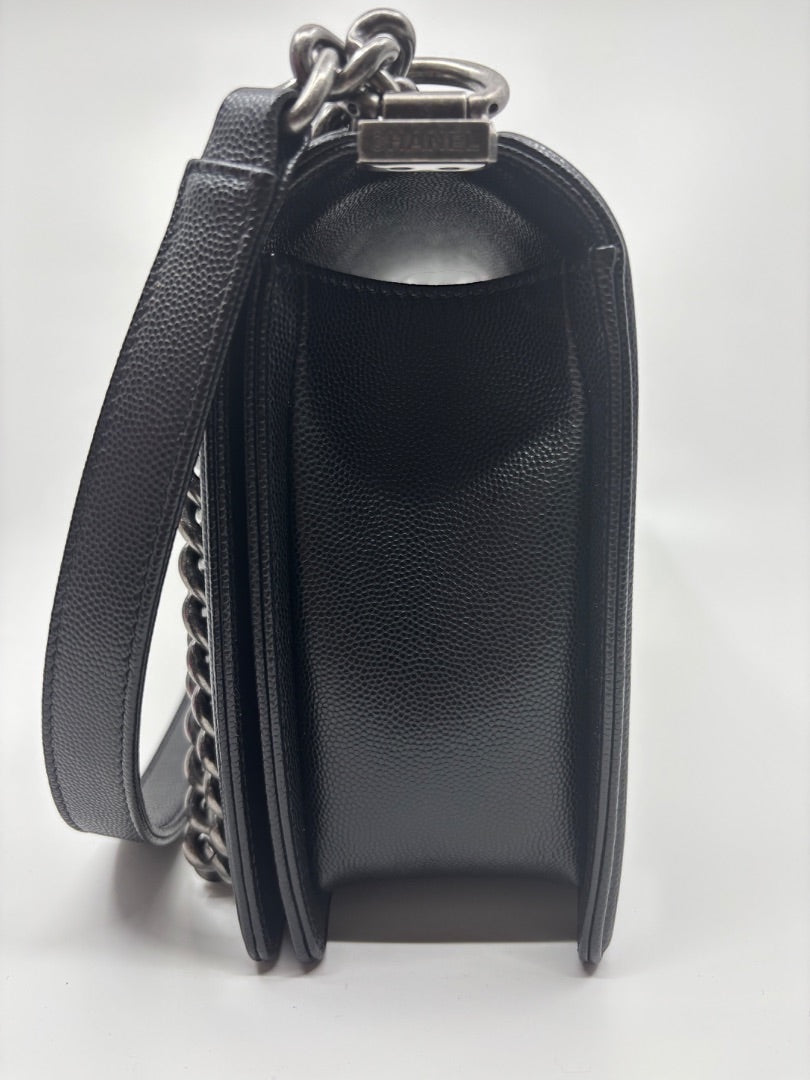 Posh Purse Co. Large black Chanel Boy Bag in caviar leather with silver hardware and chain strap.