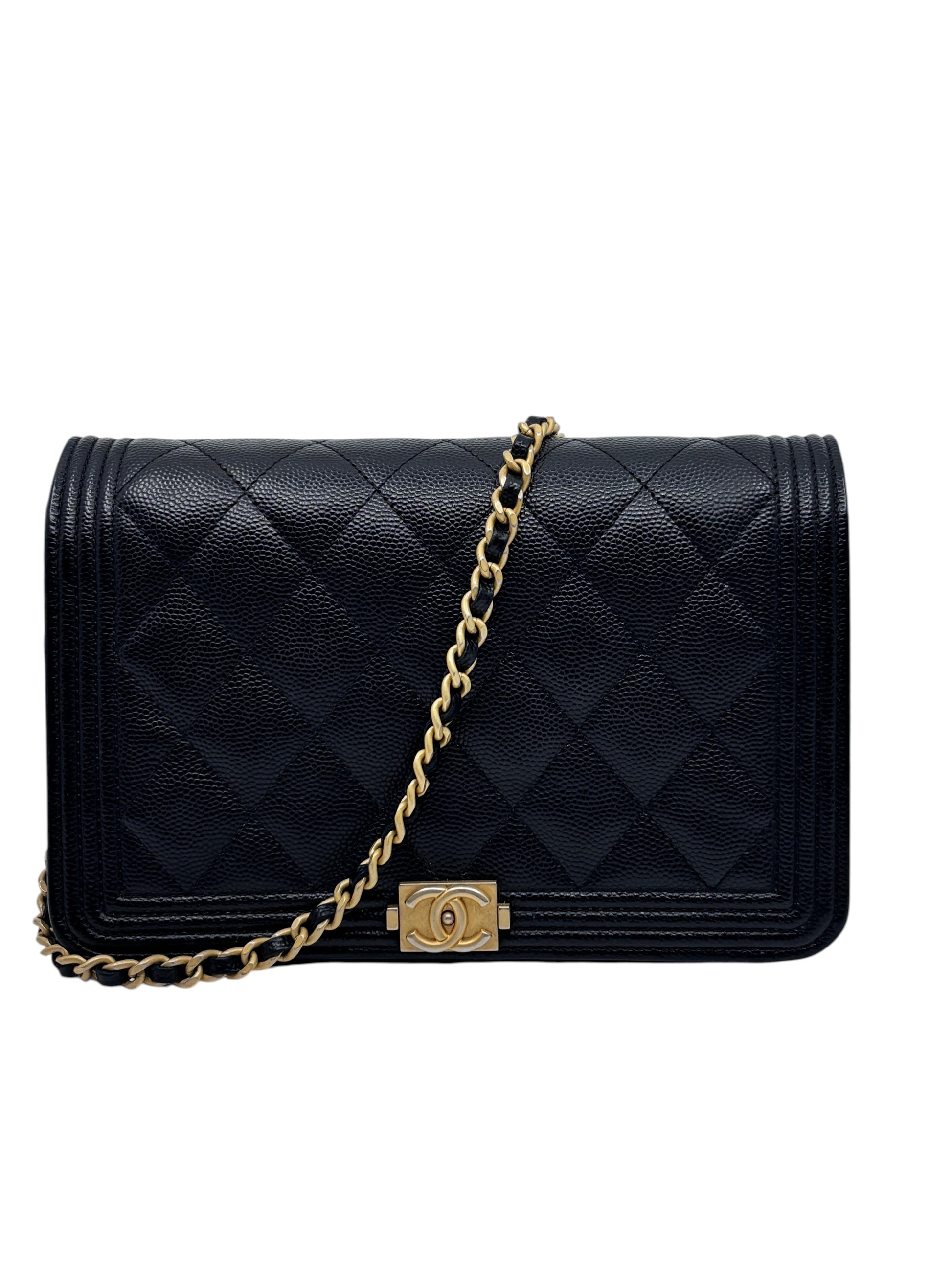 Posh Purse Co black Chanel Boy wallet on chain with quilted leather and gold hardware on a white background