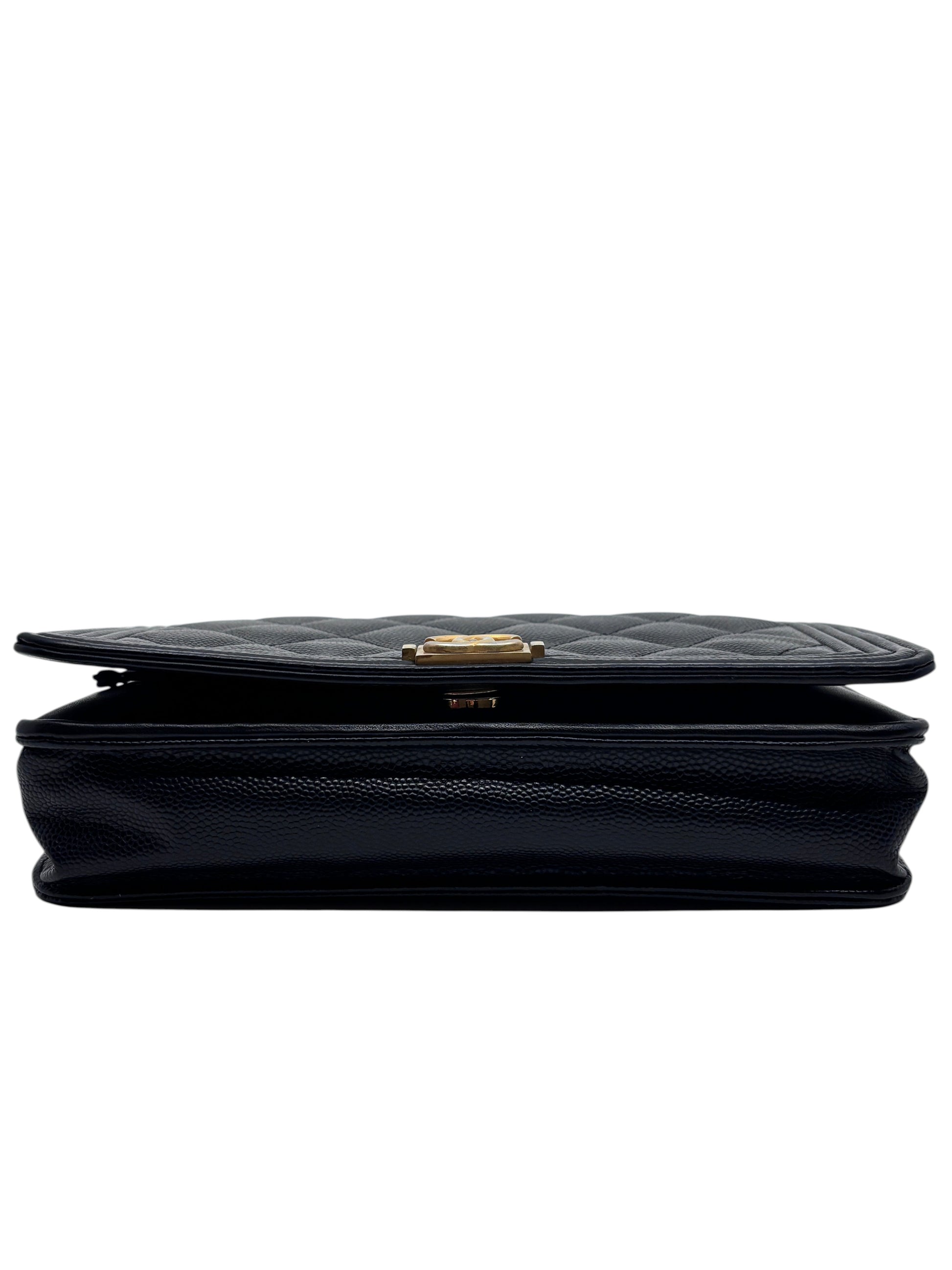 Posh Purse Co black Chanel Boy Wallet on Chain with quilted leather and gold hardware, viewed from the side.
