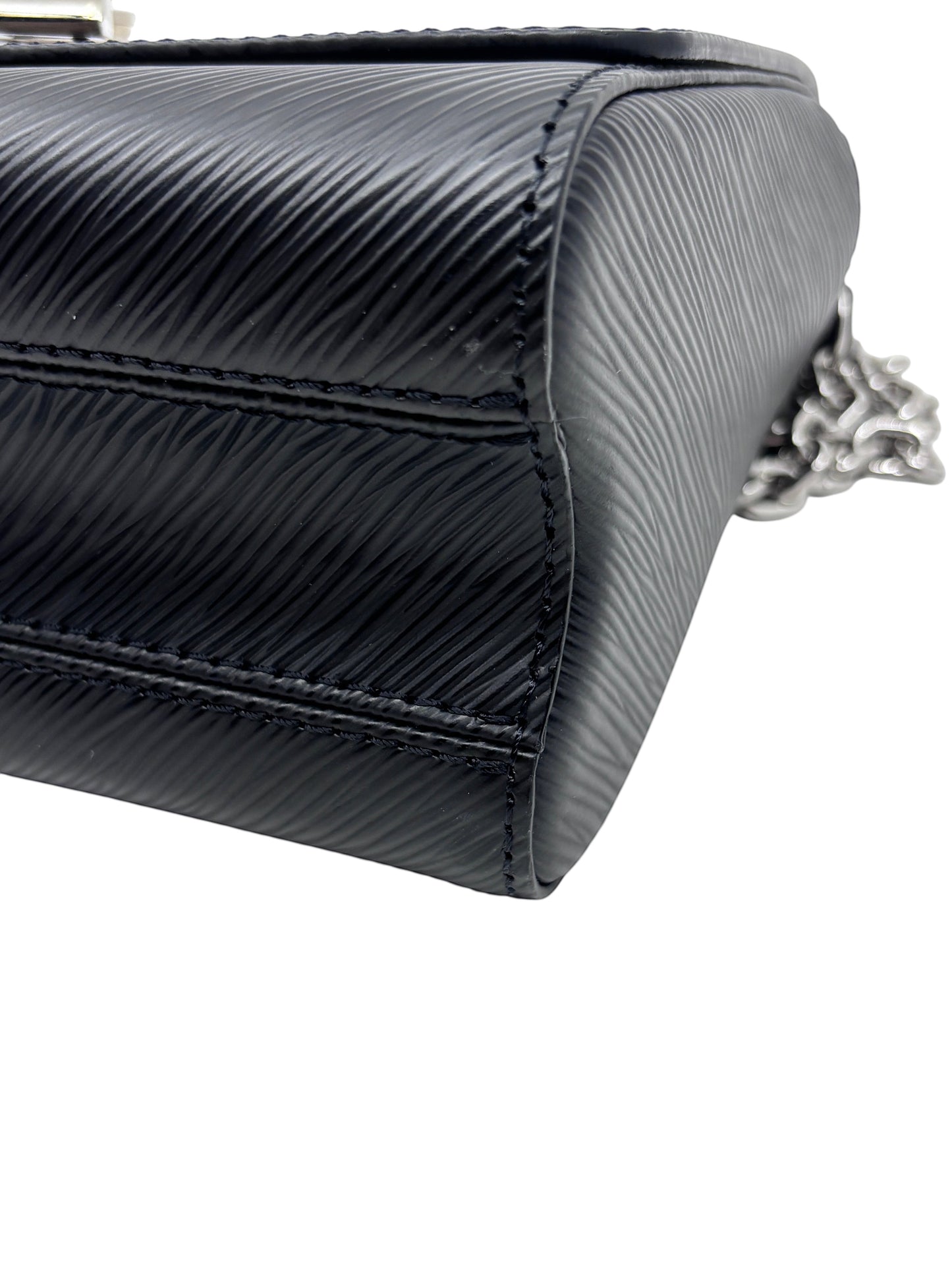 Close-up of the black textured Epi leather side panel of a Posh Purse Co Louis Vuitton Twist bag