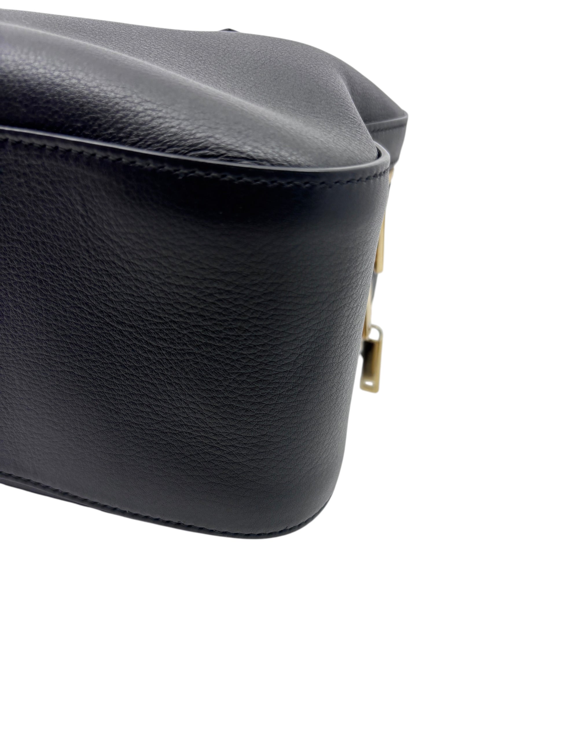 Posh Purse Co. black leather Ferragamo triple zip bag side view showing textured grain and gold hardware detail.