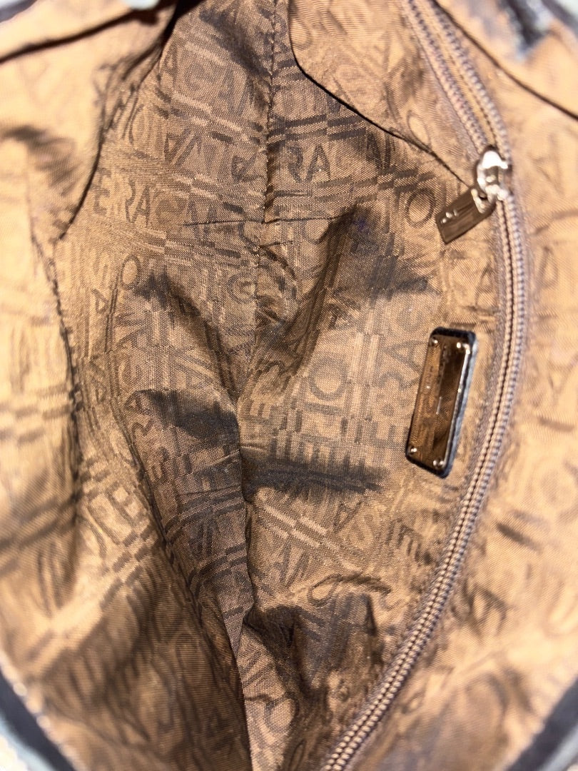 Posh Purse Co. black Ferragamo shoulder bag interior with signature logo lining and silver zipper.
