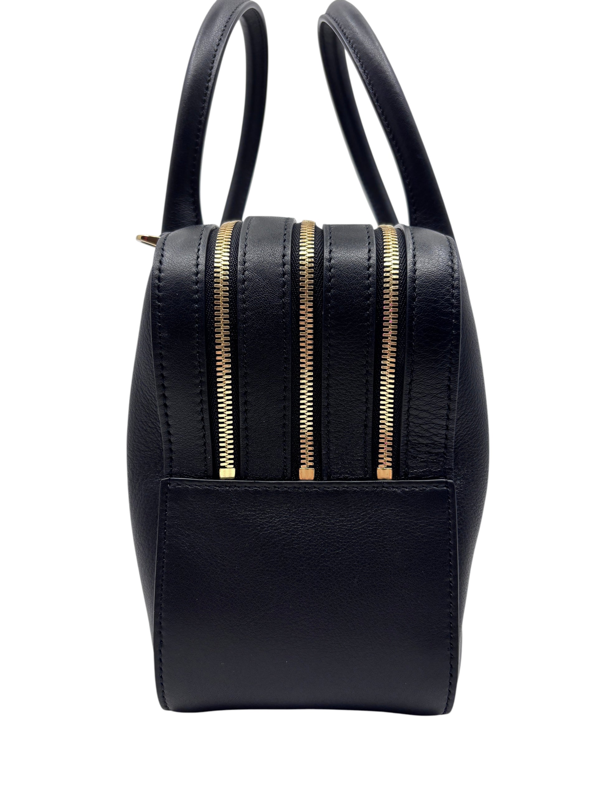 Posh Purse Co. black Ferragamo triple zip handbag showing side profile with gold hardware and structured leather design