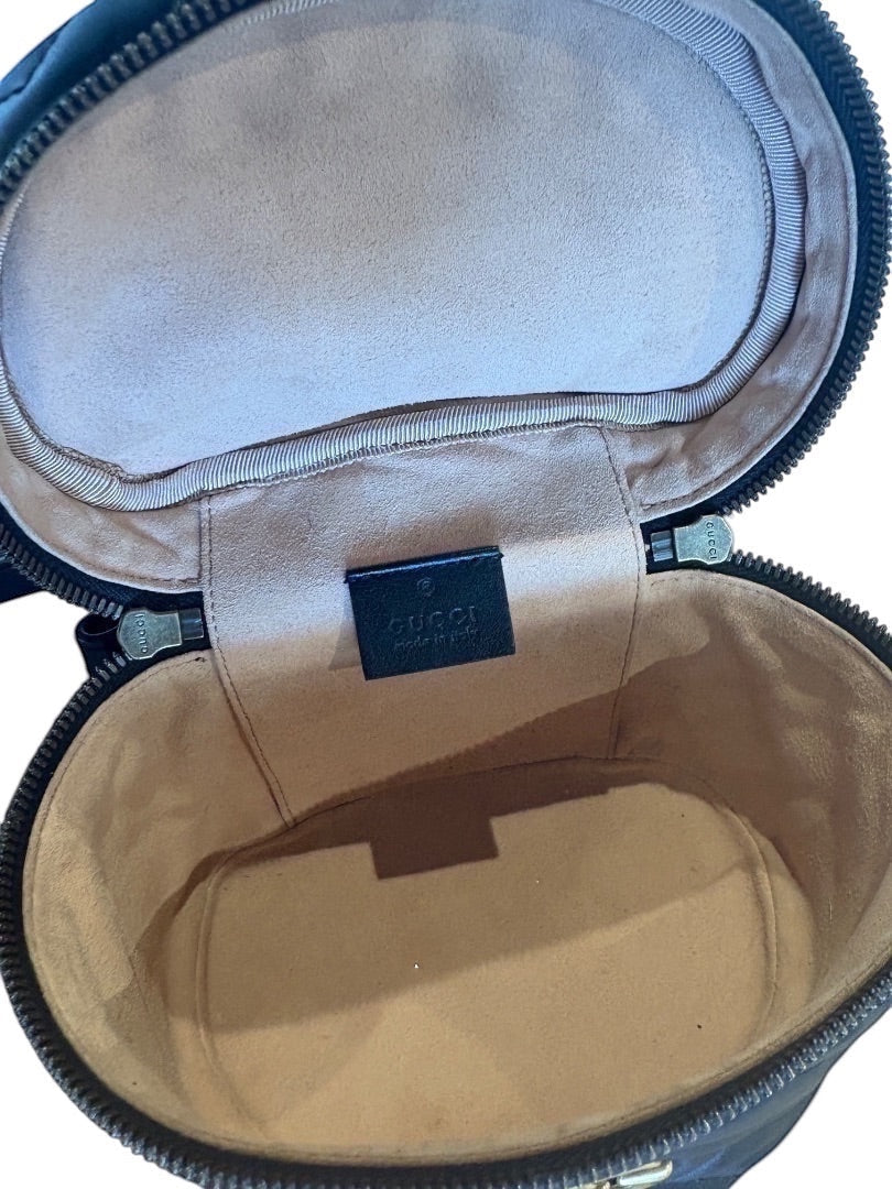 Posh Purse Co black Gucci GG Marmont mini backpack interior with suede lining and Gucci logo tag.