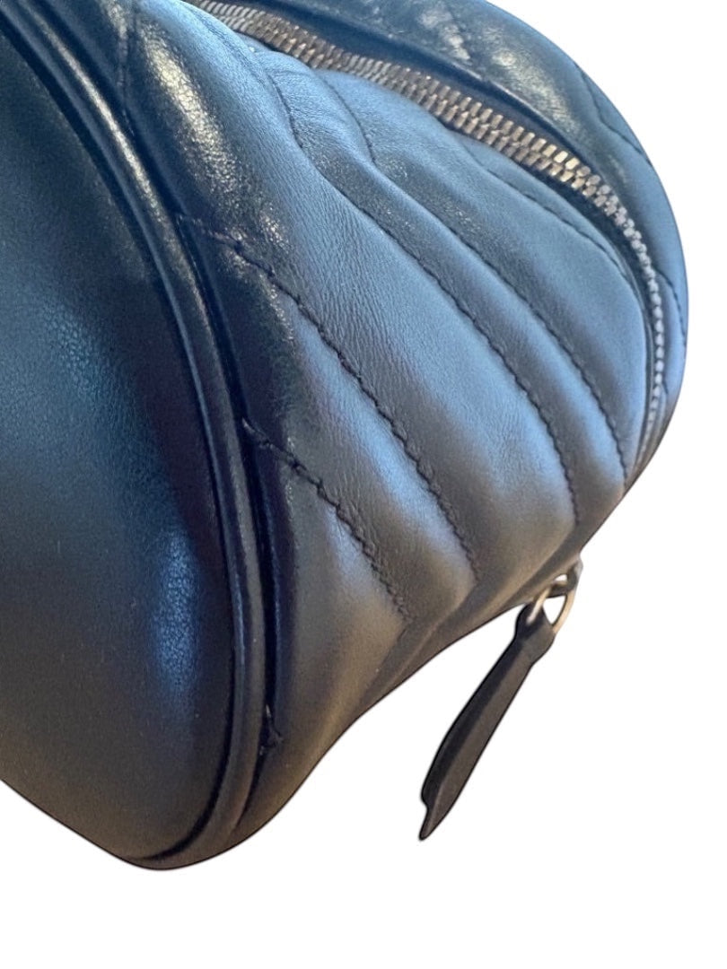 Posh Purse Co black Gucci GG Marmont mini backpack in matelassé chevron leather with antique gold-tone hardware.