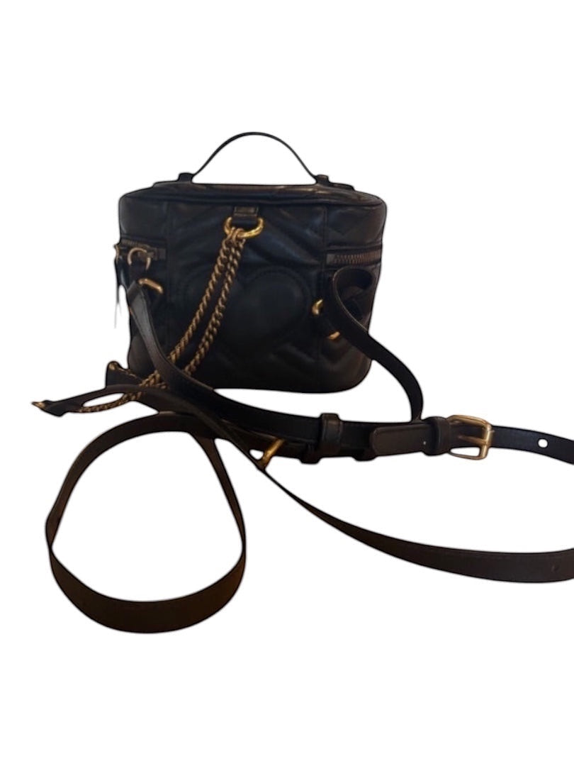 Posh Purse Co black Gucci GG Marmont mini backpack in matelassé chevron leather with antique gold hardware.