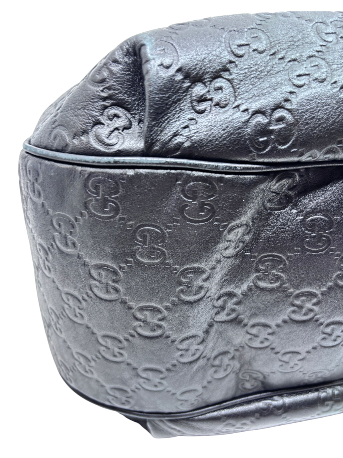 Close-up of black embossed leather Gucci Horsebit 1955 hobo bag from Posh Purse Co. showing signature GG pattern.